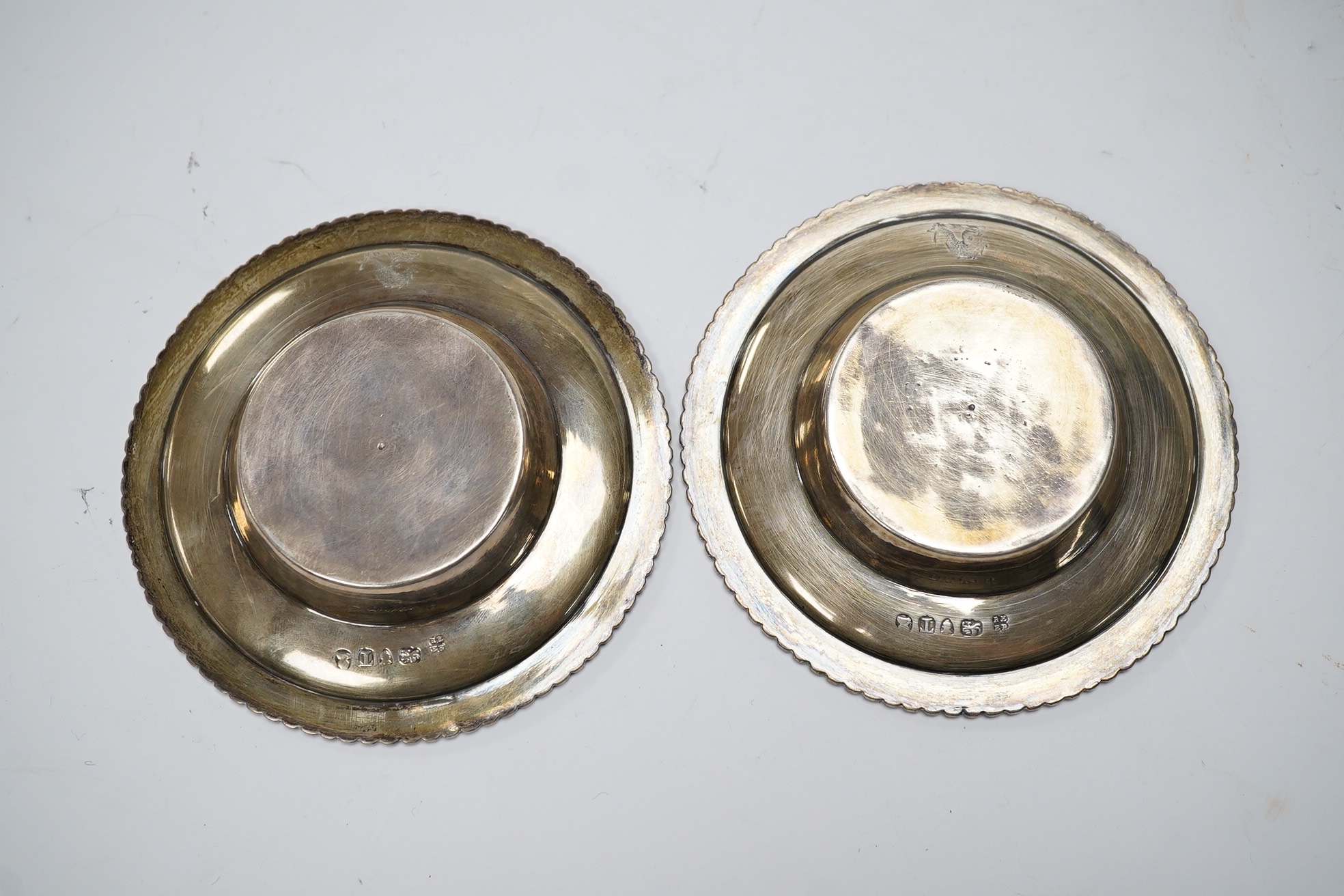 A pair of George III silver dishes or stands, with gadrooned borders, Emes & Barnard, London, 1814, diameter 10.9cm, 5.3oz.